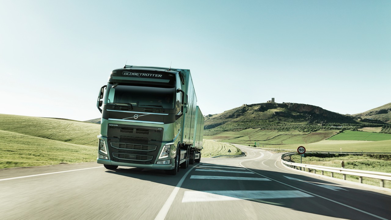 Volvo FH driving in green landscape