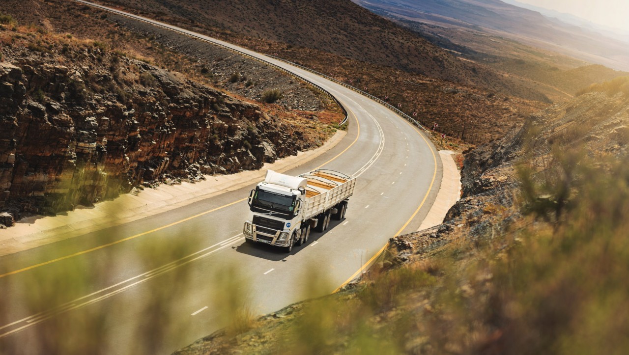 A Volvo FH drives through a dry South African landscape